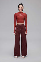 A woman wearing a red top and red pants