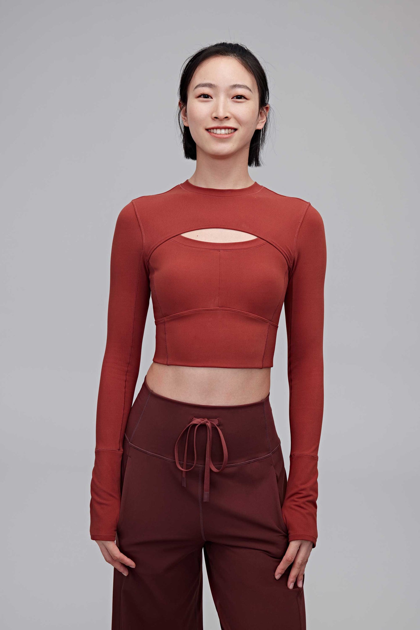 A woman wearing a red top