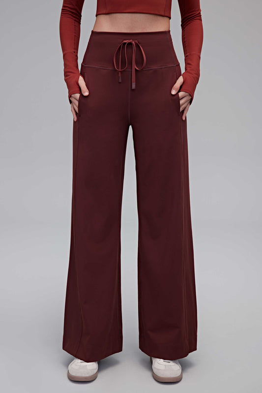 A woman wearing red pants