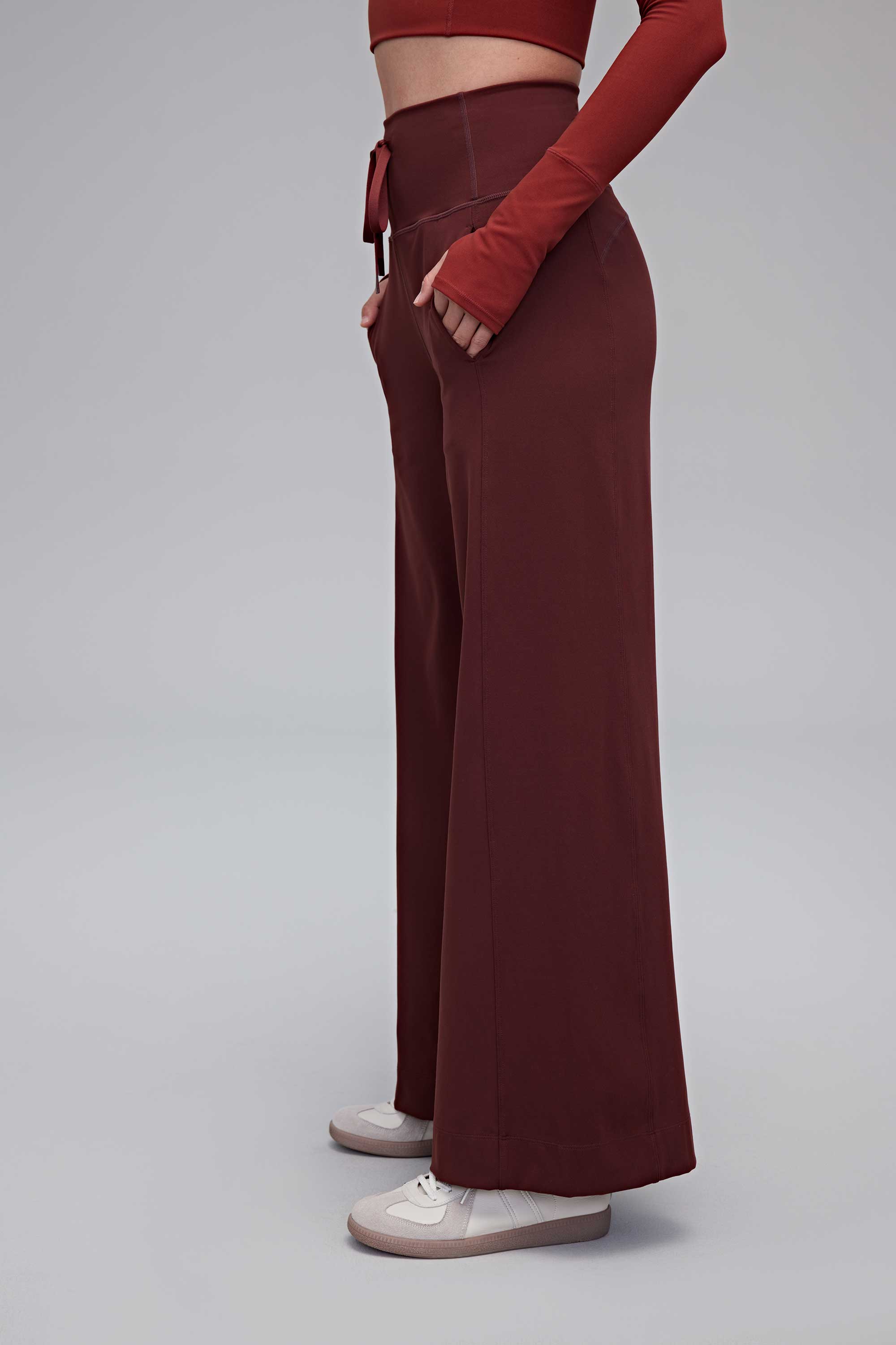 A woman wearing red pants