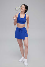 woman in blue sports bra and skorts