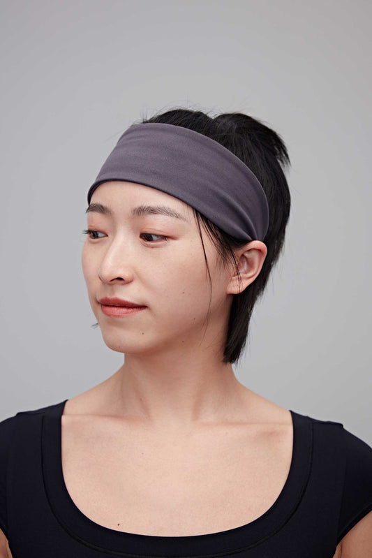 Woman wearing grey headband