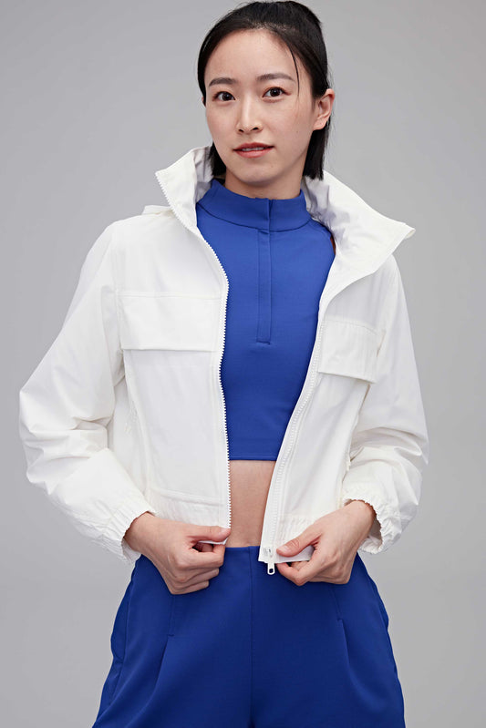 woman in white jacket