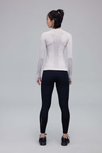 back of woman in black leggings and grey top