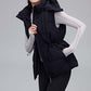 woman in black hooded down vest