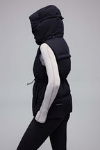 woman in black hooded down vest