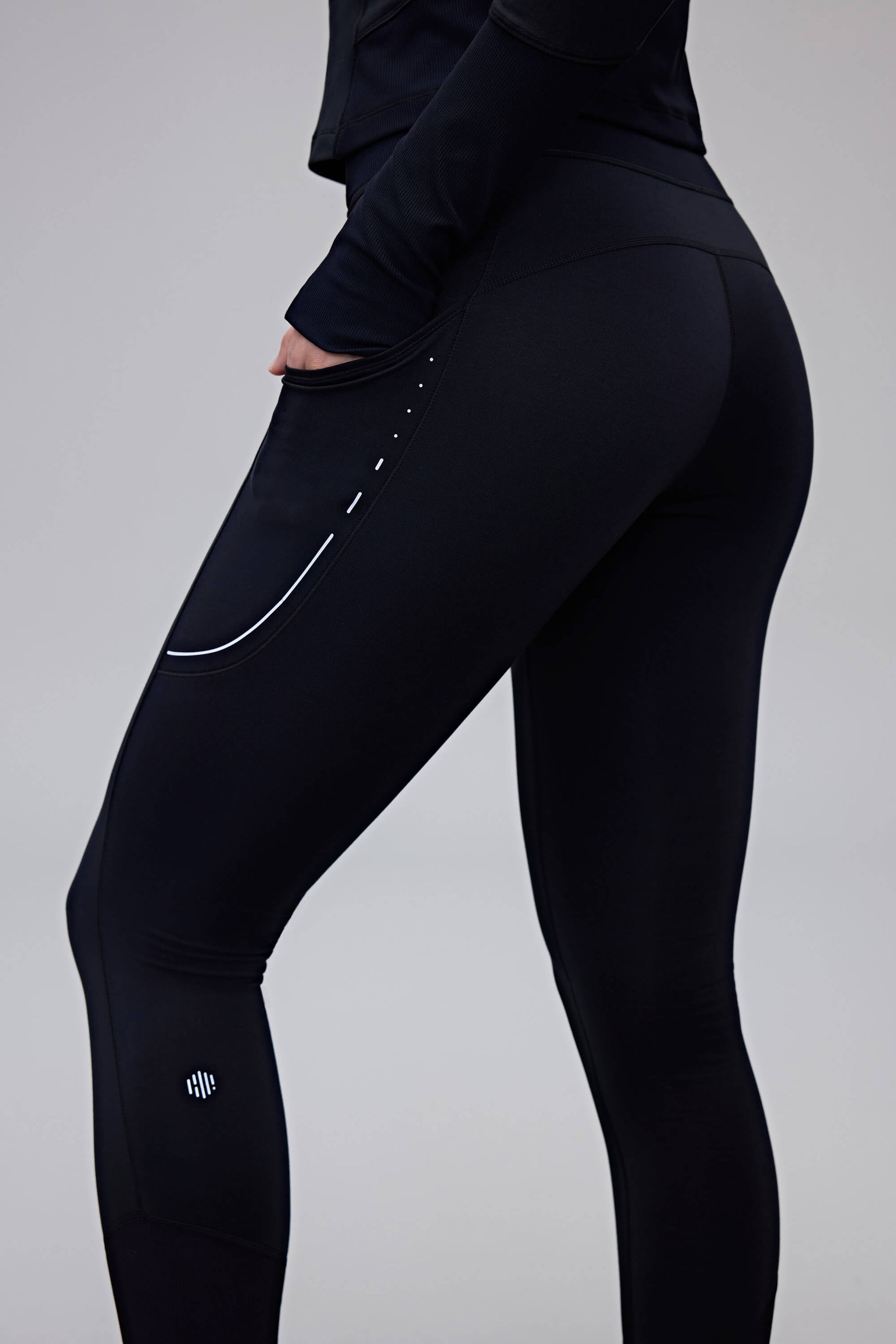 close up of woman in black leggings