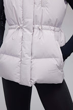 close up of woman in grey down vest