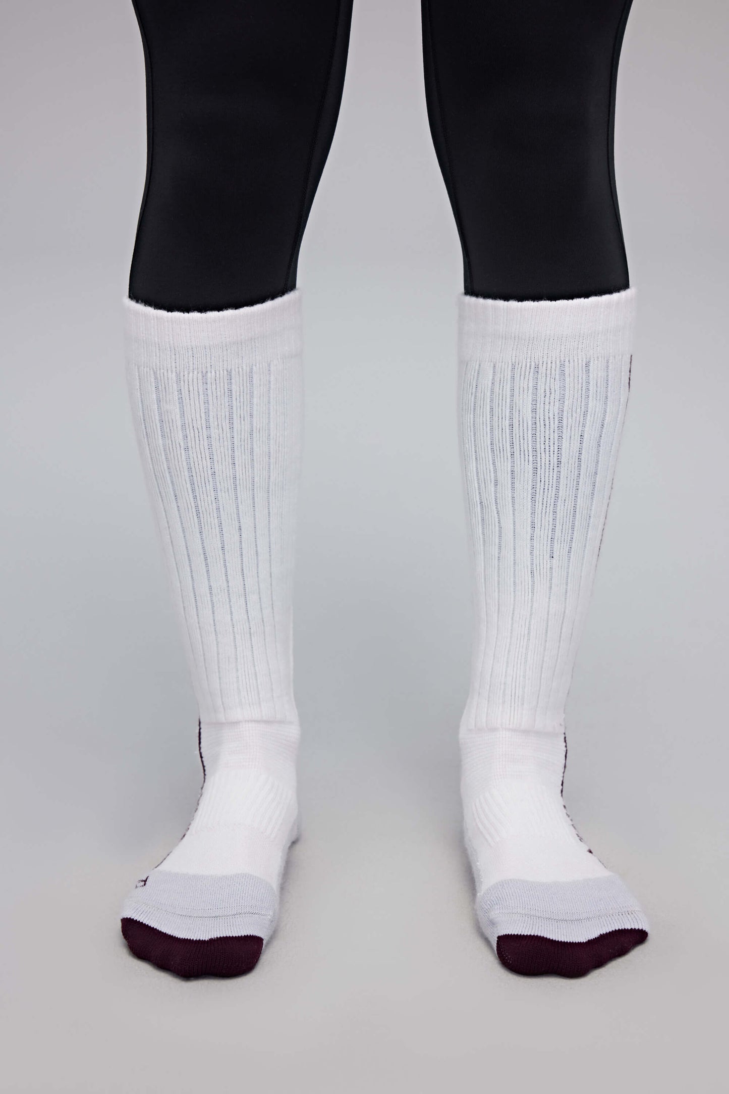 a person wearing white wool socks