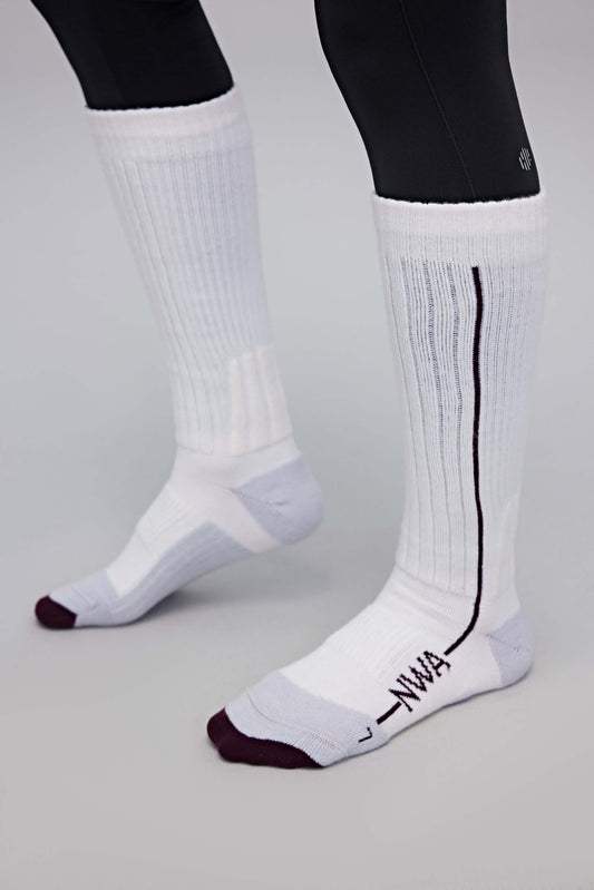 a person wearing white wool socks