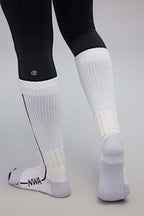 back of a person wearing white wool socks