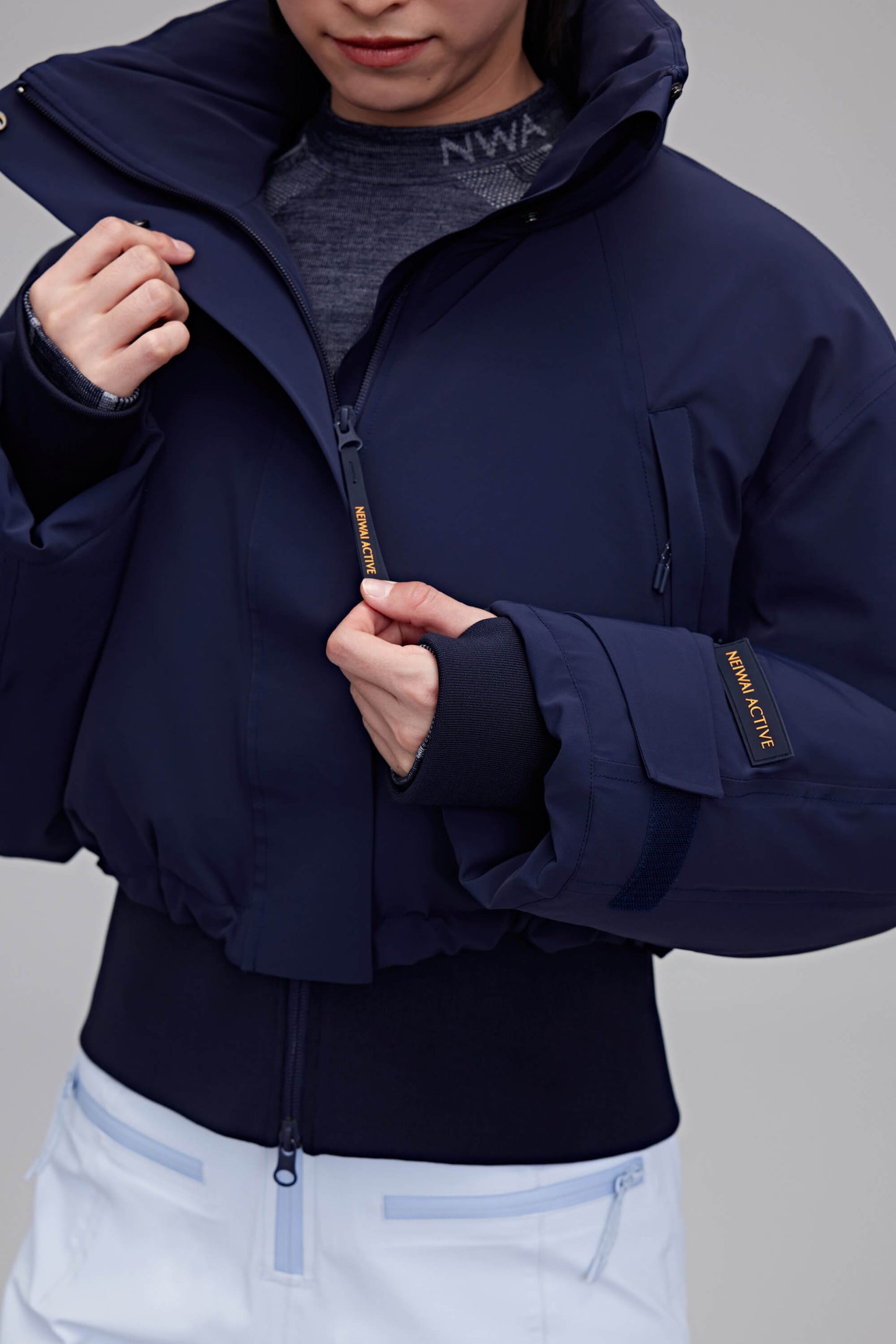 woman in navy down jacket