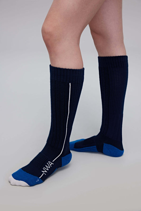 a person wearing navy wool socks