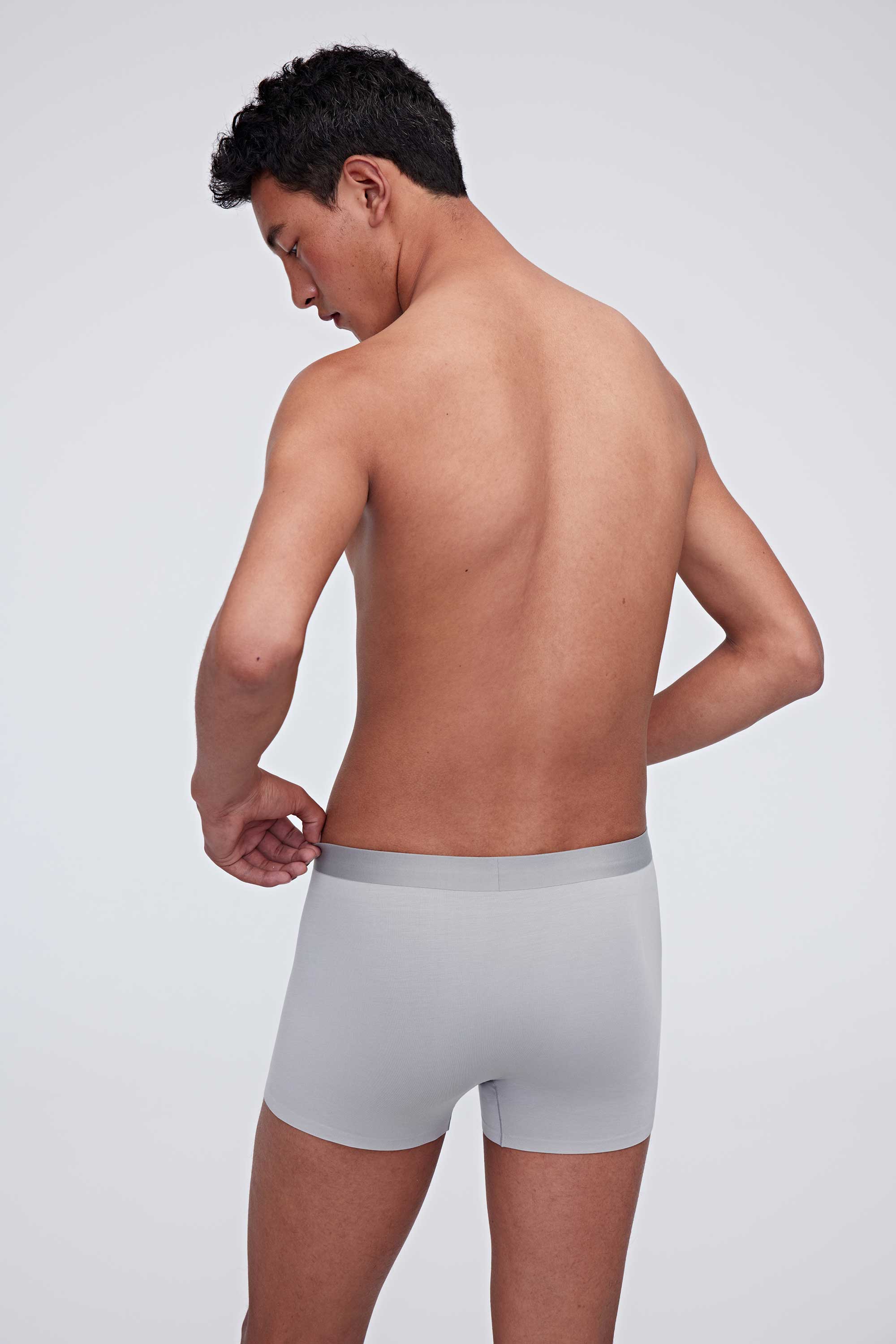 back of man in grey brief