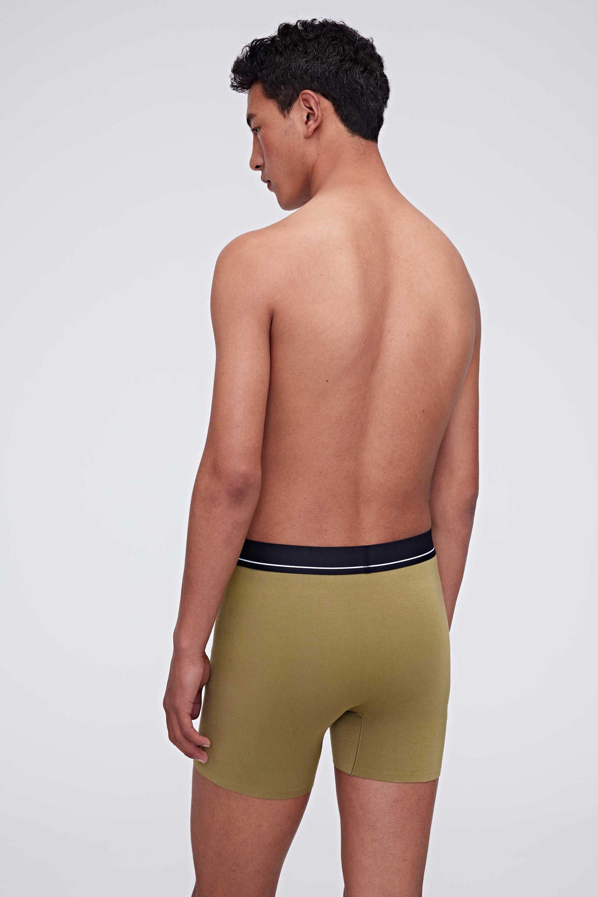 back of man in green brief