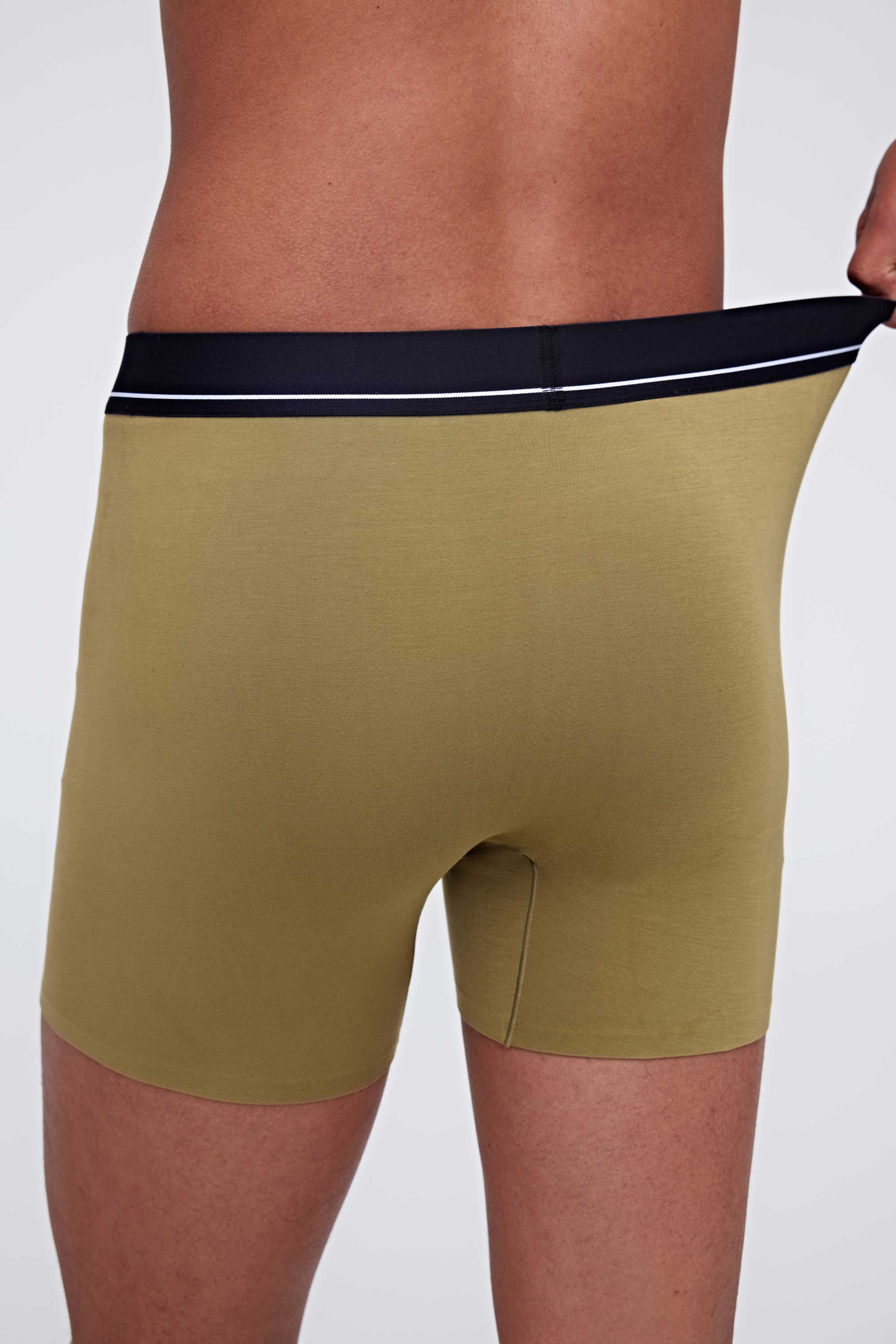 back of man in green brief