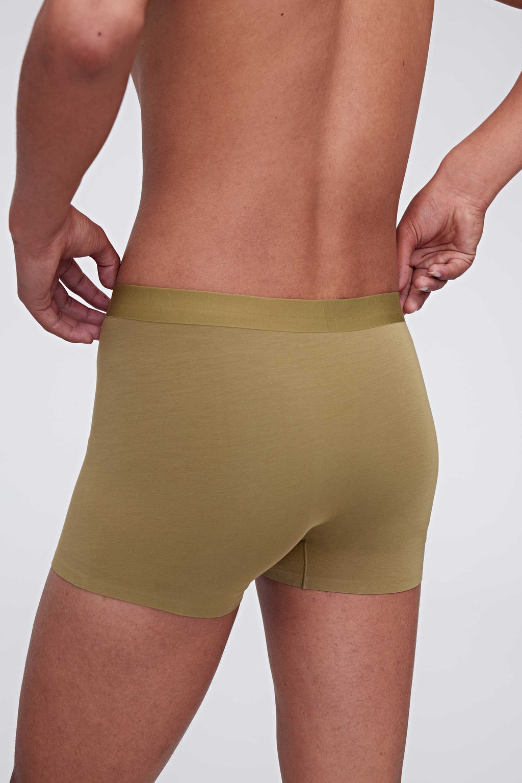 back of man in green brief