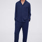 Man in navy pajama top and pants