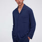 man in navy pajama button up shirt and pants