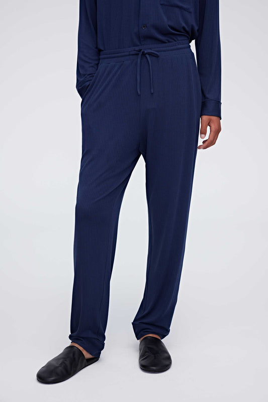 Man in navy pajama pants