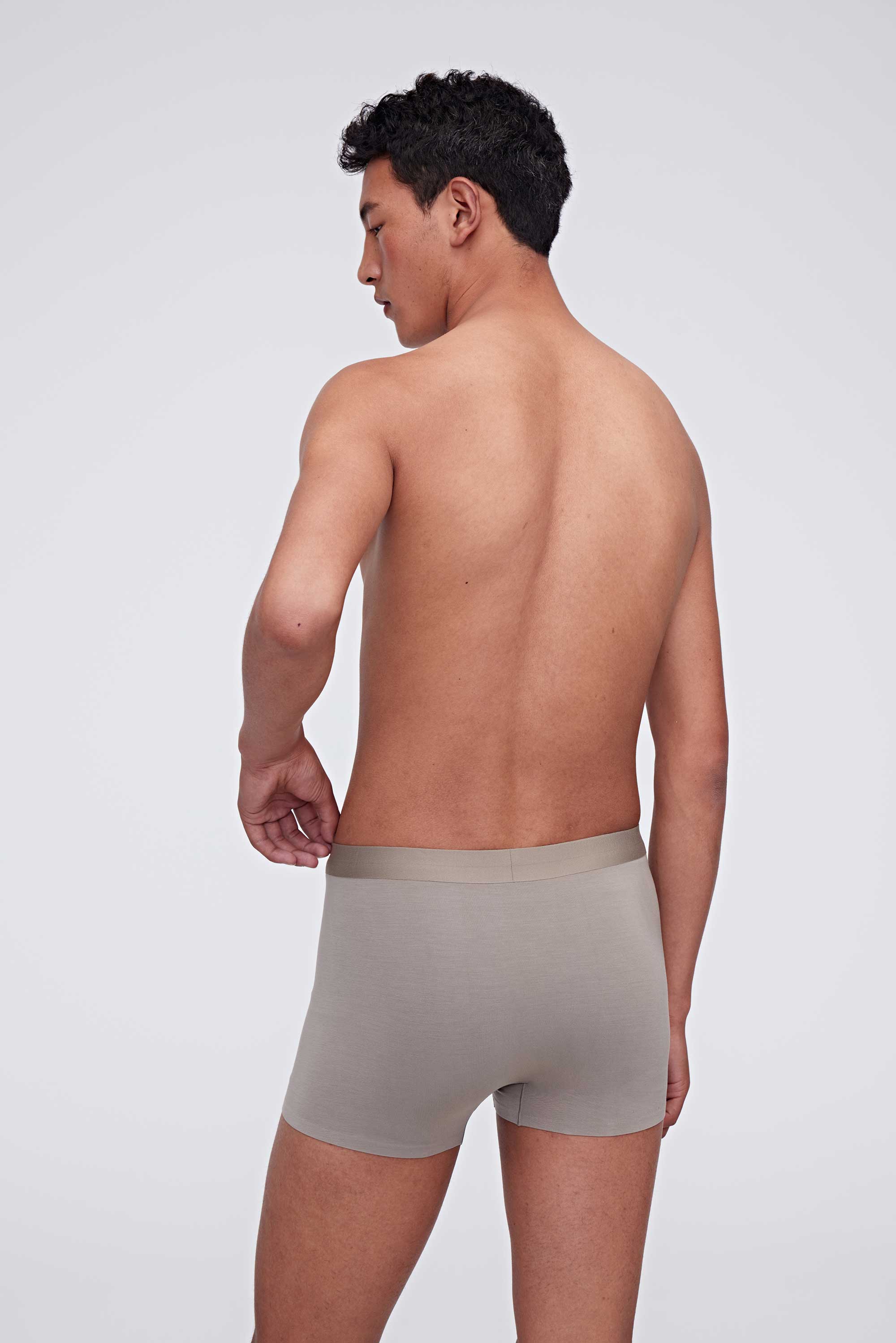 back of man in grey brief