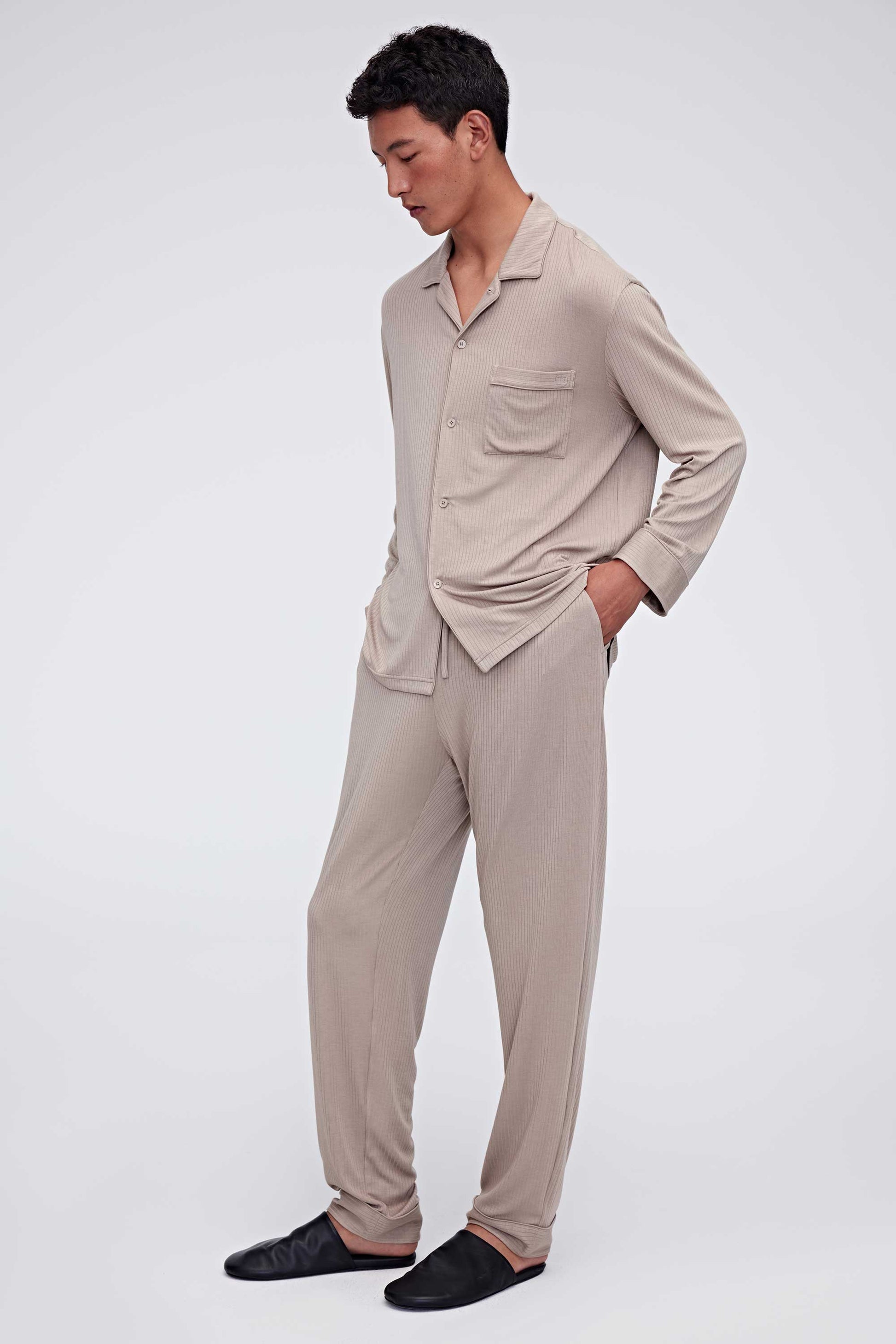 man in tan pajama button up shirt and pants