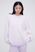 A woman wearing purple plush fleece pajama top