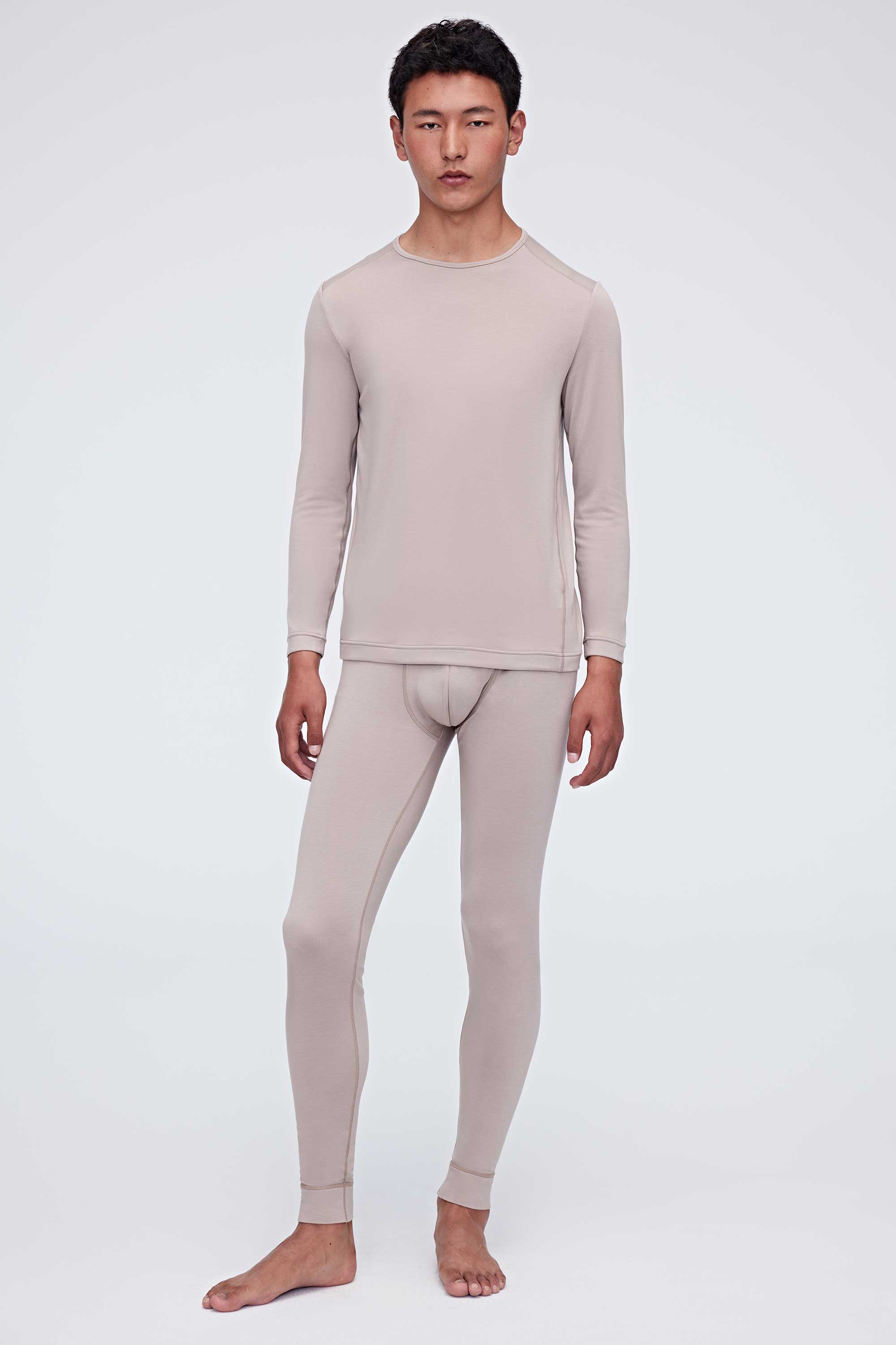 A man wears a ginger gray thermal set