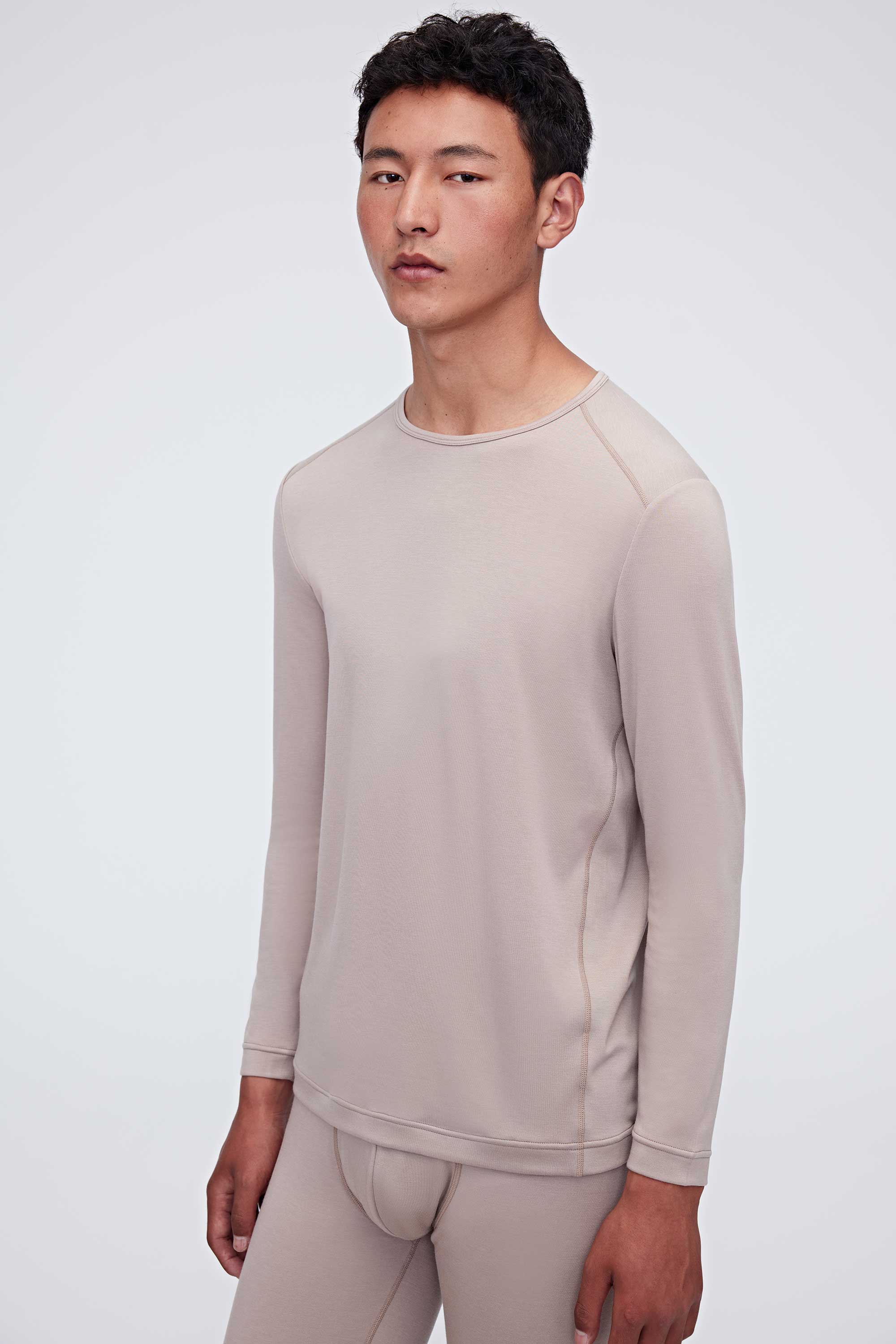 A man wearing a ginger gray thermal set