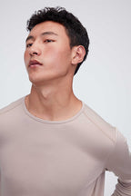 A man wearing a ginger gray thermal top