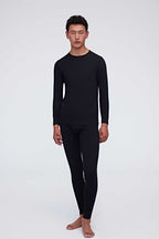 A man wearing a black thermal set