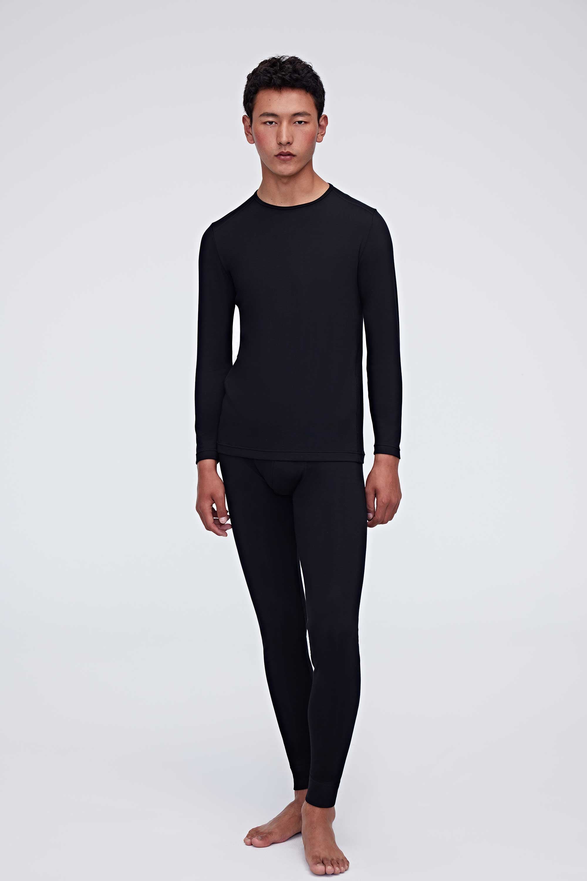 A man wearing a black thermal set