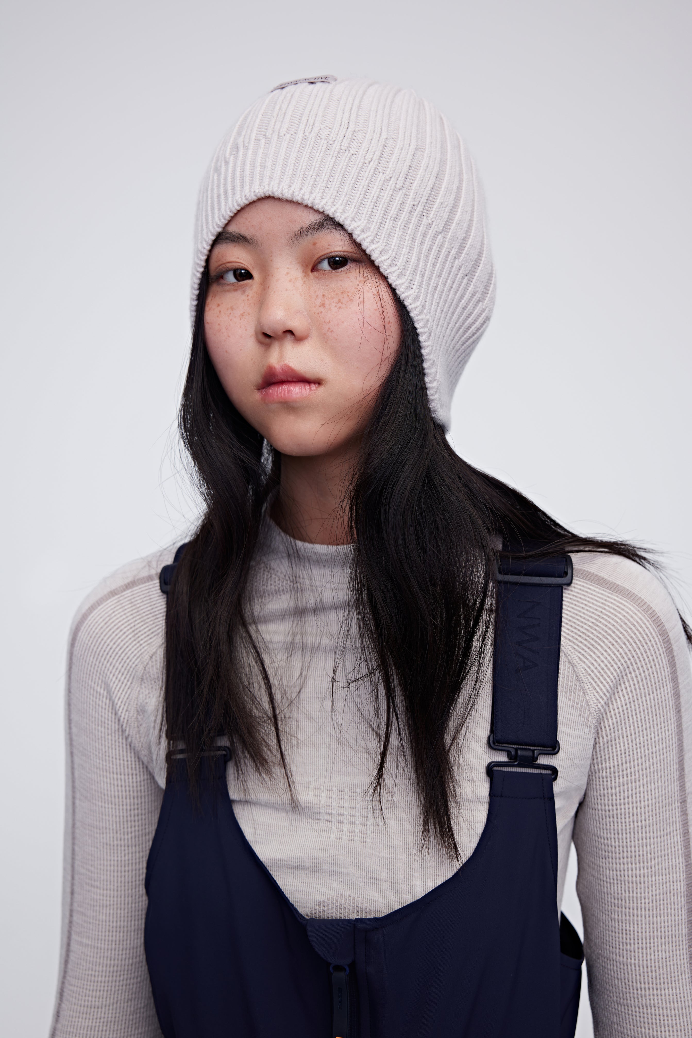 Woman wearing cream wool beanie
