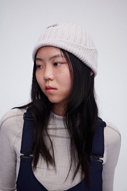 Woman wearing cream woolen beanie