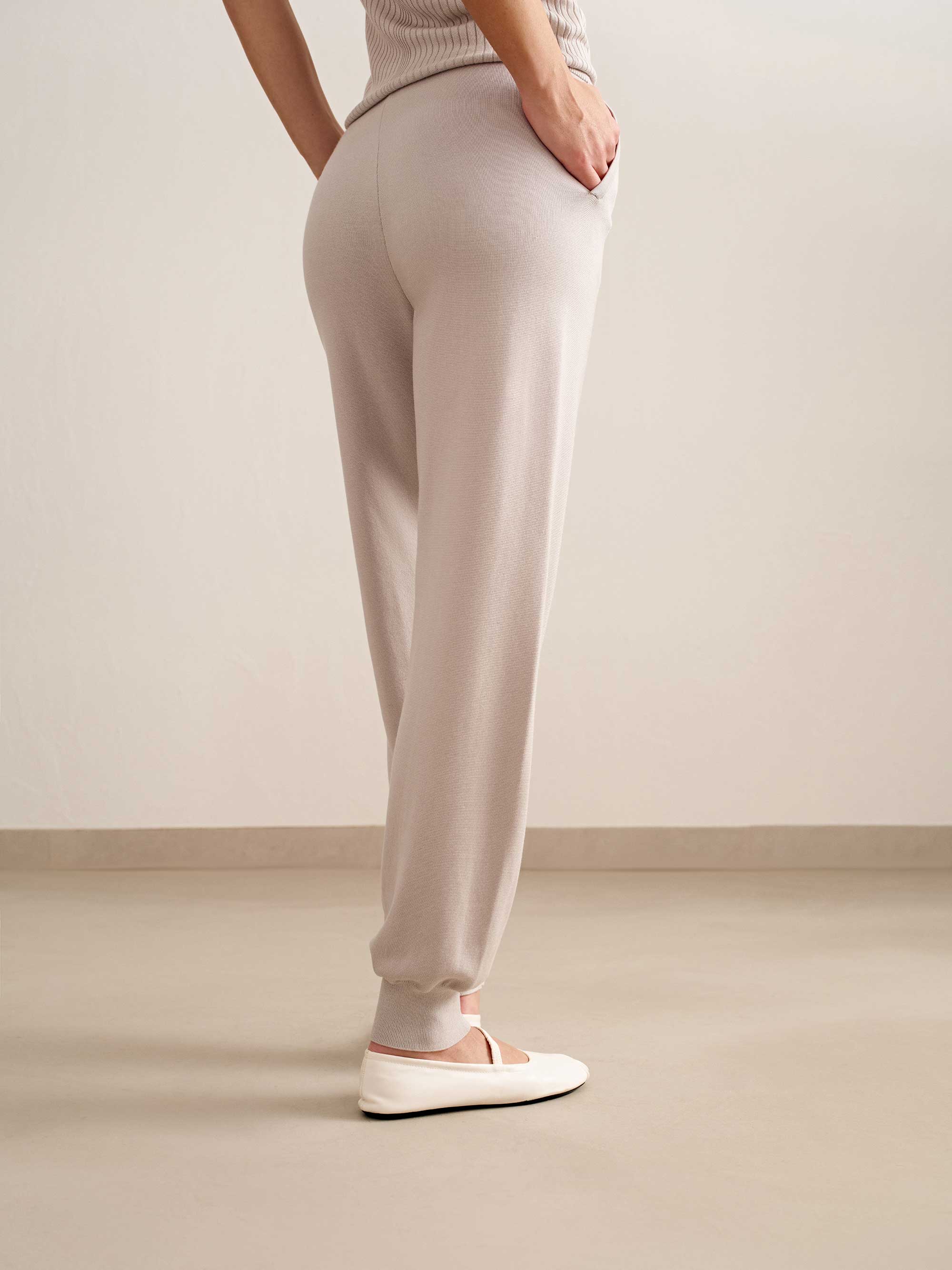 woman in light pink joggers