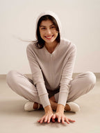 woman in light pink hoodie and joggers