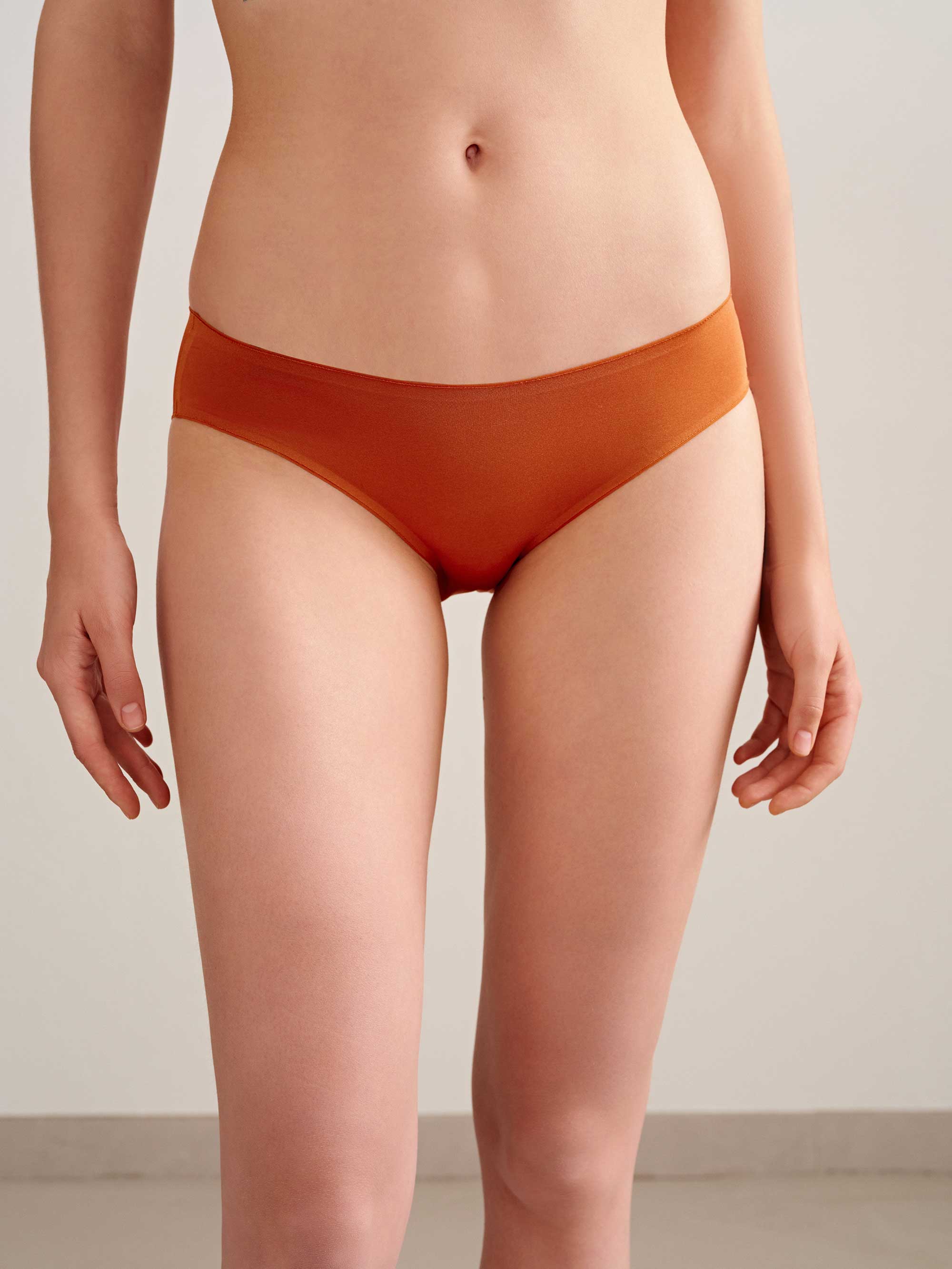 woman in orange brief