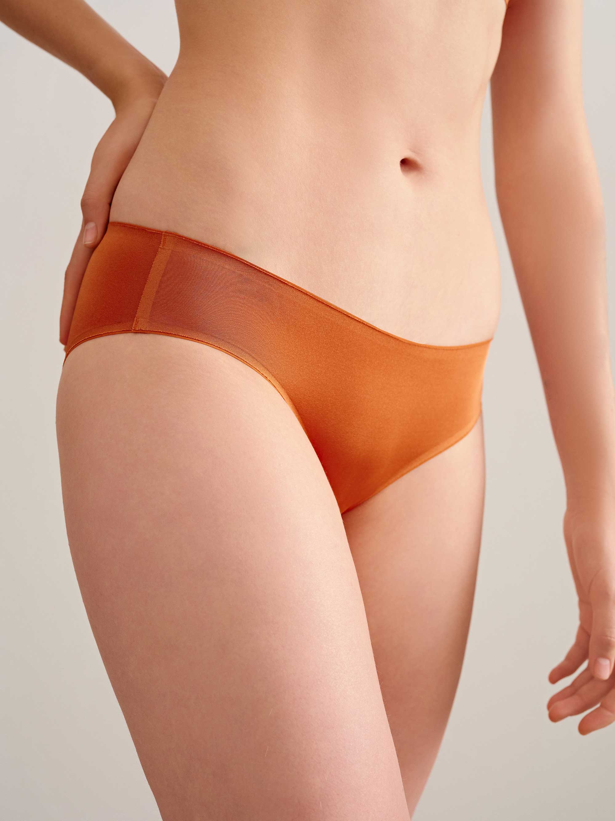woman in orange brief