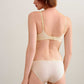 back of woman in cream bra and brief