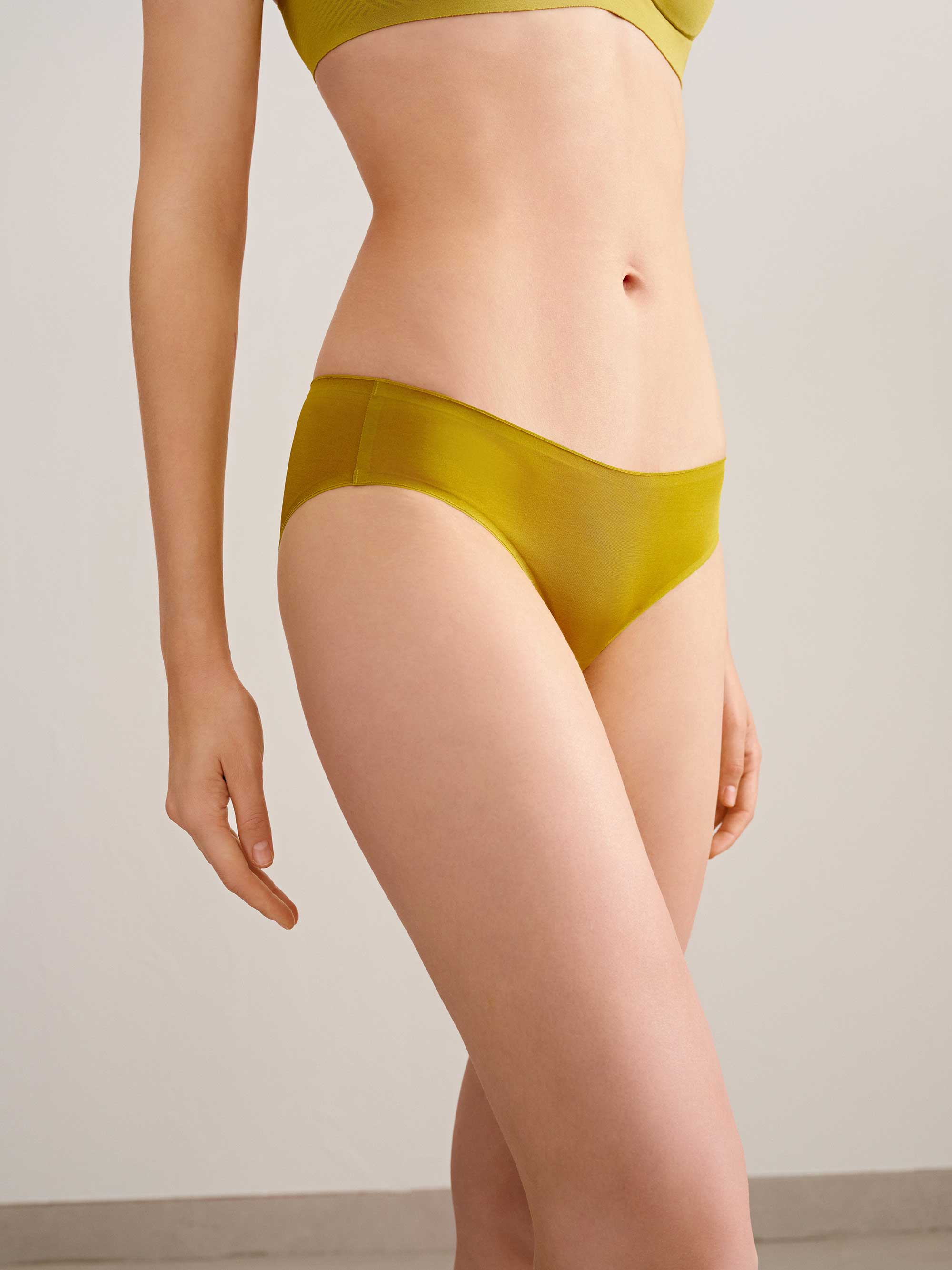 woman in mustard brief