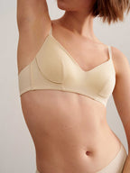 a woman wearing light beige bra.