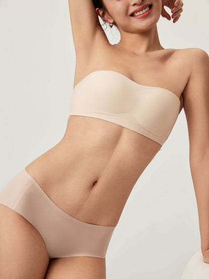 Model wearing nude bandeau bra and briefs