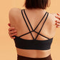 back of the black sports bra and brown leggings.