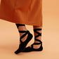 side of a woman wearing barre socks