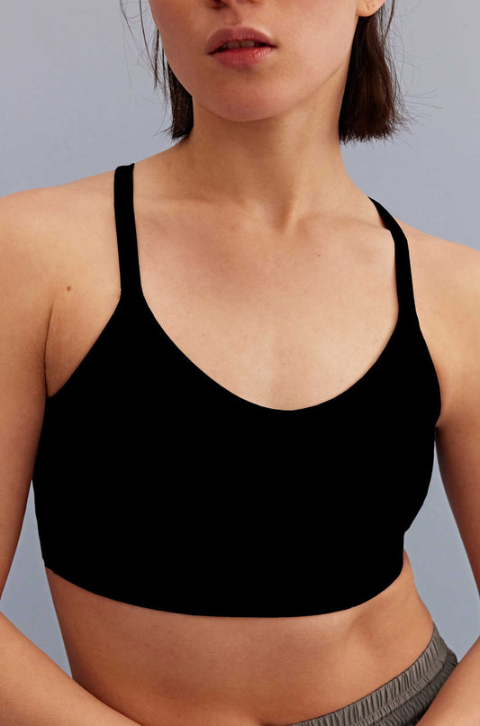 a woman wearing a black sports bra