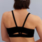 back of a woman wearing metallic headband and black sports bra