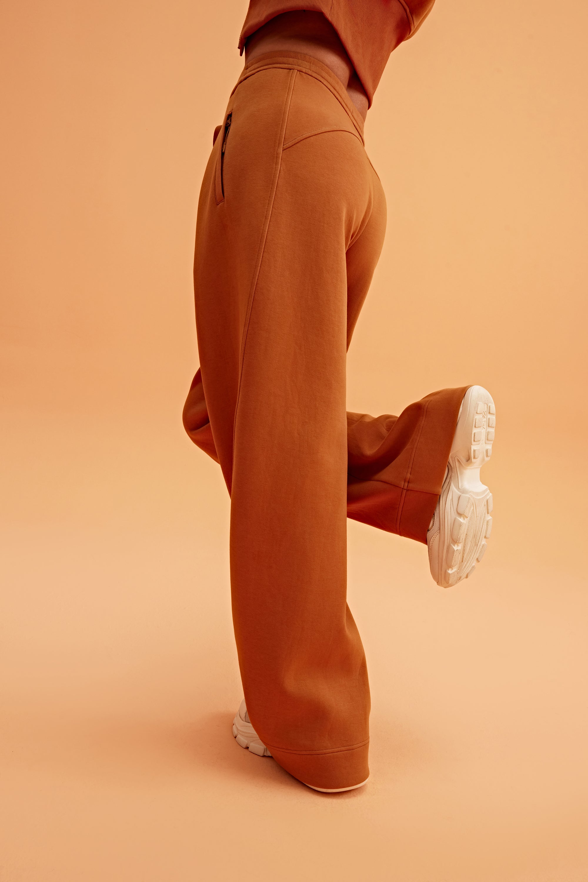 woman in caramel wide leg pants