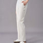 A side view of a model wearing off-white straight-leg pants, paired with white sneakers. The pants feature a relaxed fit with a drawstring waistband, side pockets, and subtle seam details down the front.