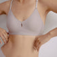 Closeup of woman wearing light gray bra with center cutout detail