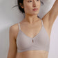 Woman wearing light gray bra with center cutout detail